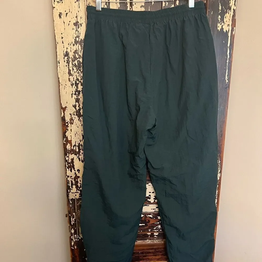 Men’s Vintage Reebok Nylon ankle zip track pants.
